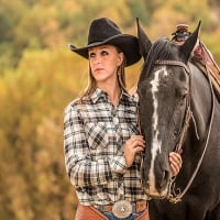 Cowgirl With Her Horse