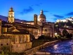 river flowing through an ancient city in tuscany