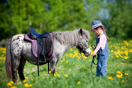 Cute Cowgirl - hat, trees, kid, girl, grass, horse, child, flowers, saddle, cowgirl, field