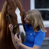 A YOUNG COWGIRL AND FRIEND