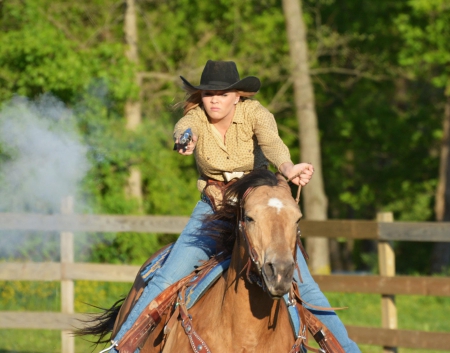 Armed and Dangerous - gun, fence, horse, trees, hat, cowgirl, smoke, guns