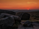 boulders on hillside at sunset