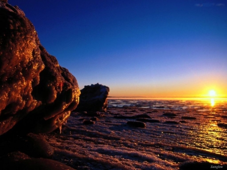 Sunset over Sea - cliff, sky, rocks, water, beach