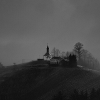 magical rural hilltop church in grayscale