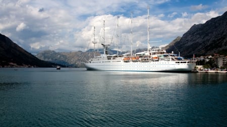 beautiful modern sail ship docked in harbor - village, clouds, sail ship, harbor, dock, mountains