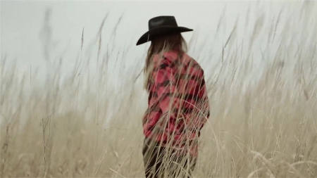 Cowgirl In A Field - girls, famous, fields, women, style, fun, westerns, female, fashion, cowgirls, hats, outdoors, actors, movies