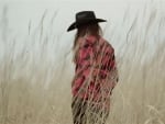 Cowgirl In A Field