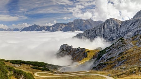 winding road down bavarian alps into sea of clouds - road, clouds, winding, mountains