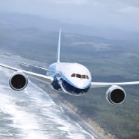 boeing 737 flying over a coastline