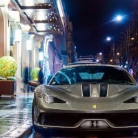 ferrari 458 supercar on a rainy paris street