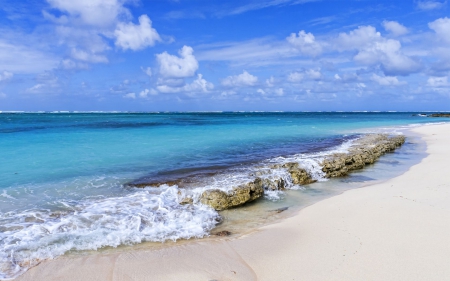 White Sand Beach - clouds, water, blue, beach, rock, sand, shore, white, nature, waves, wave, sky