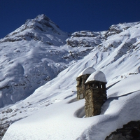 Whiteroof, snow and chimneys