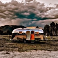 airstream trailer under stormy sky