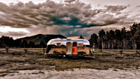 airstream trailer under stormy sky - storm, meadow, fence, trailer, clouds, motor home