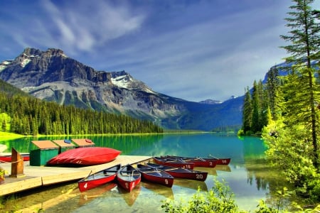 Emerald lake - sky, trees, dock, calm, quiet, emerald, lake, boats, mountain, hills, summer, shore, serenity, nature, pier, tranquil, beautiful, canada