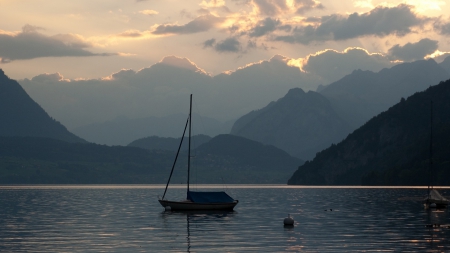 sailboat on an alpine lake at sundown - clouds, sundown, boat, lake, mountains