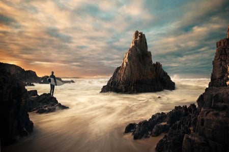 In Coming Tide - clouds, water, person, blue, beach, ocean, tide, sand, nature, sky, rocks