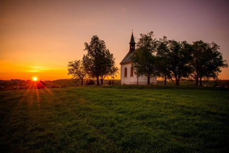 Sunset - clouds, trees, splendor, landscape, grass, church, sunrays, sunset, nature, rays, field, sun, sky