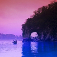 arched cliff on a river in china at dusk