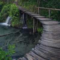 wonderful wooden bridge over a river falls