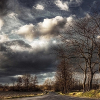 superb clouds over countryside road hdr