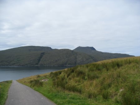 A Road in Scotland - hills and valleys, road, grassy hills, highlands, grass