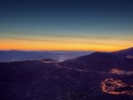 mountainside town at twilight