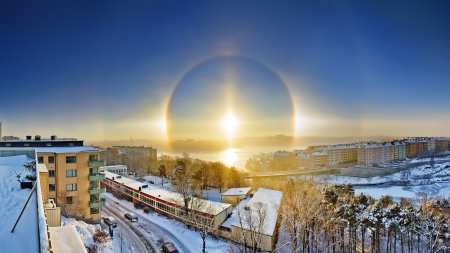 a solar halo over a city in winter - river, winter, halo, city, sun