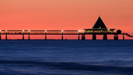 silhouette of an ocean pier in germany - silhouette, pier, sunset, sea, lights