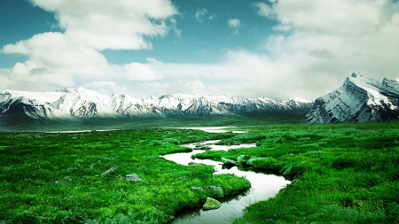 beautiful winding river in a green prairie - clouds, prairie, river, green, snow, mountains