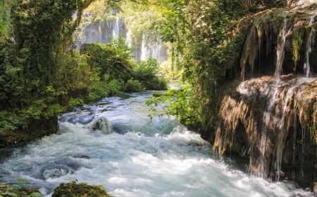 Rapids and waterfalls in the forest - panorama, stream, wood, amazing, swirl, cool, rock, branches, cascades, scenic, nature, beautiful, leaves, stones, nice, high defnition, photography, water, leaf, rivers, scene, landscapes, rapids, forests, waterfalls, moss, plants, foam, hd, splendor, scenery, grove, awesome, photo, natural