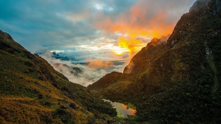 colored clouds in a wonderful ravin - clouds, pond, colors, ravine, mountains