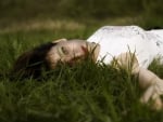 girl lying in grass