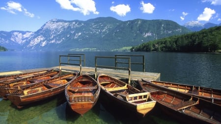 wooden boats on a lake in slovenia