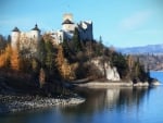 castle on a lake shore cliff