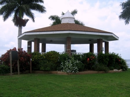 Gazebo on the Ocean - white, blue skies, sun, clouds, palms, grass