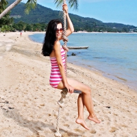 Ann Krav on a Beach Swing
