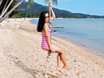 Ann Krav on a Beach Swing