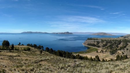 marvelous lake titicaca between peru and bolivia - sky, lake, islands, trees, shore