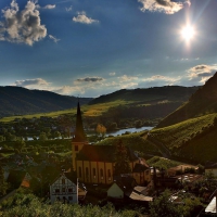 bright sunshine over church in a riverside town