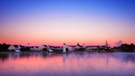 lighthouse in an urban setting at dawn - houses, lighthouse, waterfront, dawn