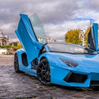 a baby blue lamborghini aventador in paris