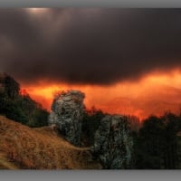 rain clouds over mountains at sunset hdr