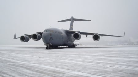 c-17 globemaster on a tarmac in snow strm - storm, transport, airport, plae, snow, tarmac