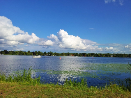 skipper on lake - boot, lake, blue, sky