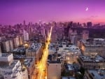 nyc avenue under a quarter moon