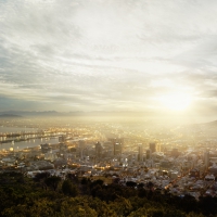 hazy sunset over seaside city