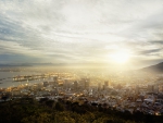 hazy sunset over seaside city