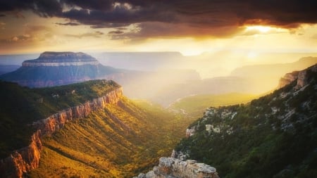 canyons under bright sunsetting sun - bright, clouds, canyons, beams, sunset, cliffs