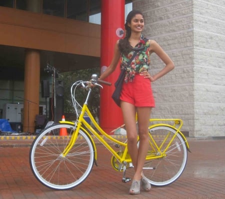 model next to yellow bicycle - sexy, girl, hot, teen, cute